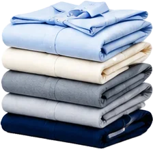 A stack of clean, pressed and folded shirts